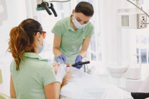 should i become a dental assistant before a hygienist